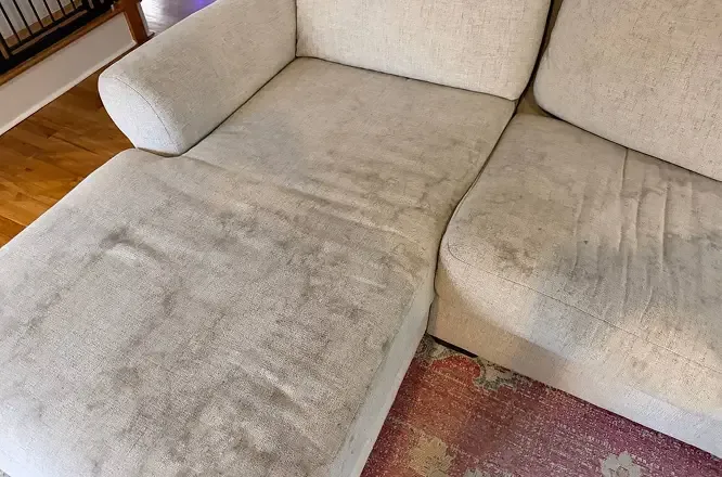 Heavily soiled sectional couch with deep stains before upholstery cleaning in Adelaide