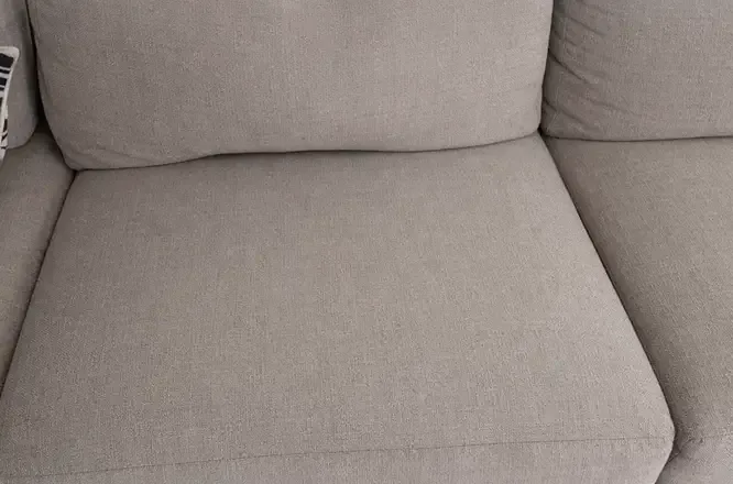 Couch seat cushion with spill stains completely removed after upholstery cleaning in Adelaide